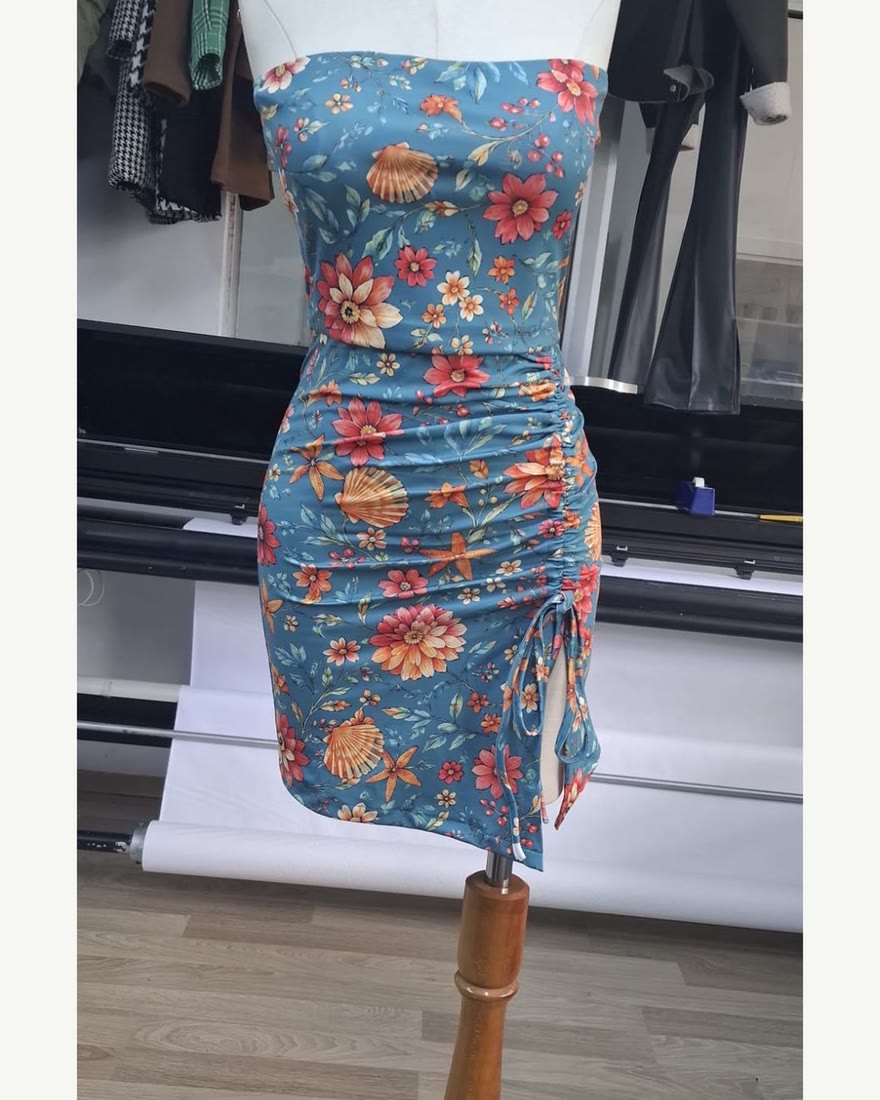 Strapless ruched dress in the same printed jersey, on a mannequin